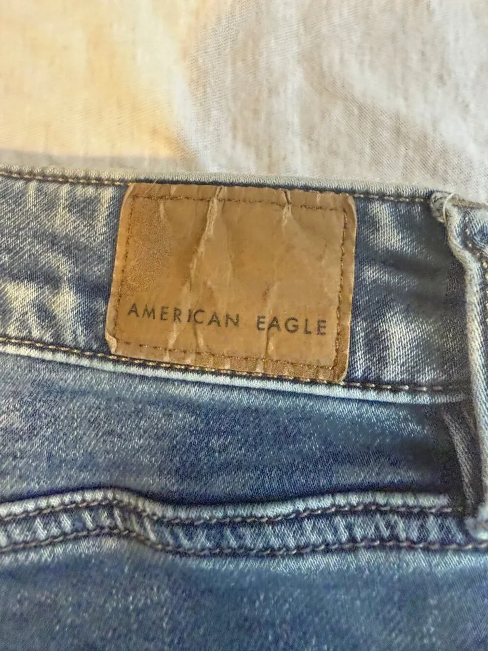 American Eagle hi Rise Jeans Size 4 Medium Blue Cotton Spandex Jeggings Raw Hem